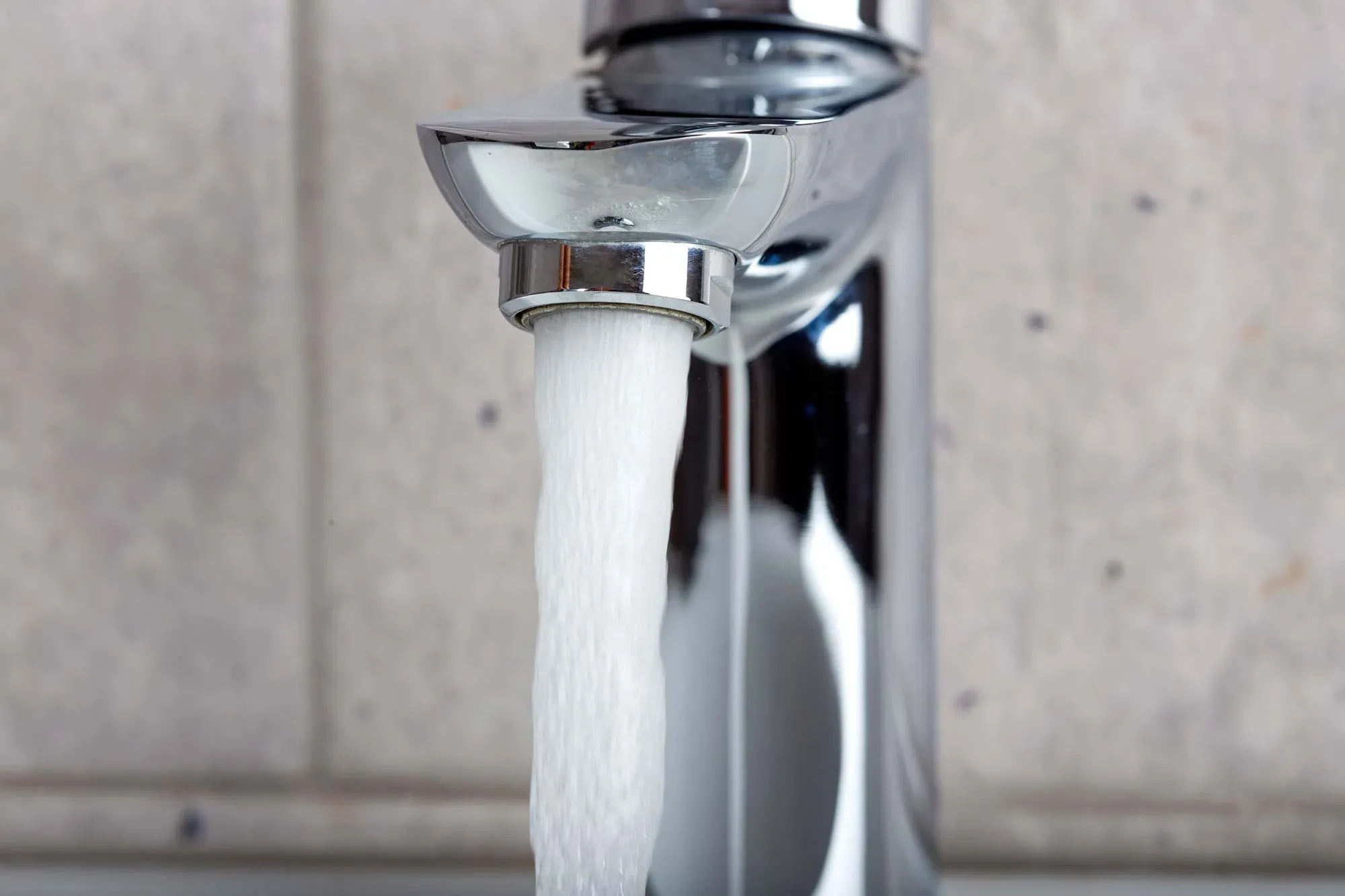 Fresh water flowing from a chrome faucet